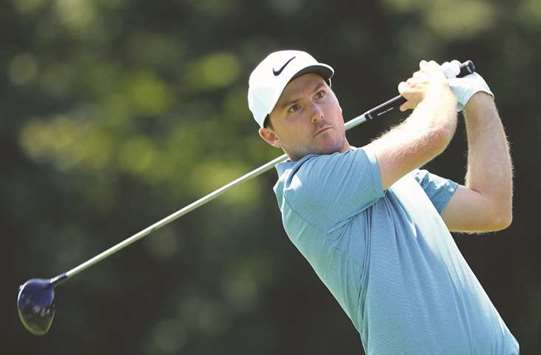 Russell Henley of the United States plays his shot from the 18th tee during The Northern Trust tournament in Westbury, New York. (AFP)