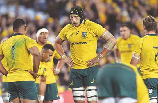Australia's Adam Coleman (C) is ruled out of today's match due to a shoulder injury. (AFP)