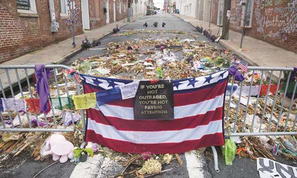 Civilisations are undone in many ways, not all of them obvious. Flowers, candles and other items are placed in memory of Heather Heyer in Charlottesville.