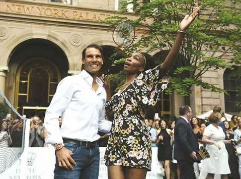 Venus Williams of the USA poses with world number one tennis player Rafael Nadal of Spain following their match in the Lotte New York Palace Invitational Badminton Tournament at the Lotte New York Palace in New York.
