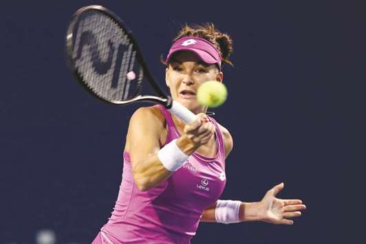 Agnieszka Radwanska of Poland returns a shot to Shuai Peng of China during their match in New Haven on Thursday.