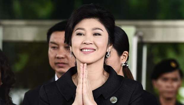 Former Thai prime minister Yingluck Shinawatra greeting her supporters as she leaves the Supreme Court in Bangkok. File photo taken on July 21, 2017. AFP