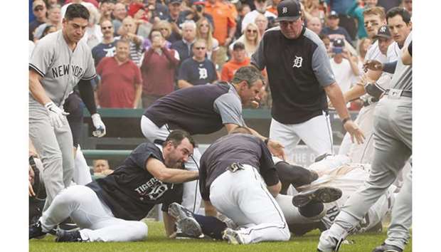 Detroit Tigers' Miguel Cabrera shoved Yankees catcher Austin Romine and threw punches at him in the sixth inning as the benches cleared for the first time. (USA TODAY Sports)