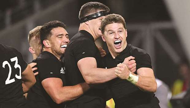 New Zealandu2019s Beauden Barrett (right) celebrates after a try with teammates Anton Lienert-Brown (left) and Scott Barrett during the Rugby Championship second test against Australia, at the Forsyth Barr Stadium in Dunedin yesterday. (AFP)