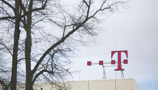 The T-Mobile logo is seen on top of the Deutsche Telekom headquarters in Bonn. u201cWe need investments in fibre and copper while at the same time the government still holds shares in Deutsche Telekom and Deutsche Post,u201d Otto Fricke, a member of the FDPu2019s national leadership and a former budget committee chairman in the lower house of parliament, said.