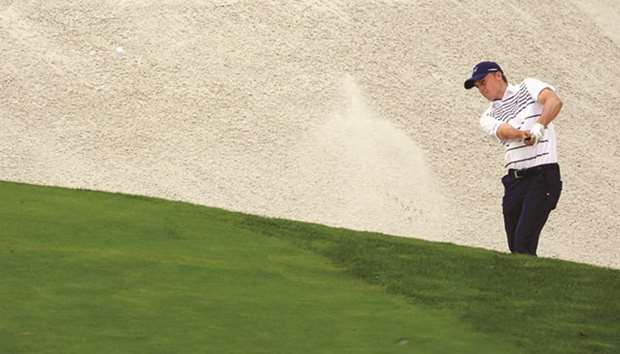 Jordan Spieth plays a shot from a bunker on the 18th hole during The Northern Trust tournament at Glen Oaks Club in Westbury, New York, on Friday. (AFP)