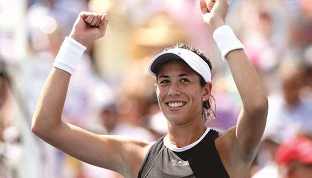 File photo Garbine Muguruza of Spain celebrating her win over Simona Halep of Romania during the womenu2019s final on day 9 of the Western & Southern Open at the Lindner Family Tennis Center on August 20.