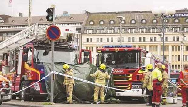 Rescue personnel cordon the area in Turku Market Square where several people were stabbed.
