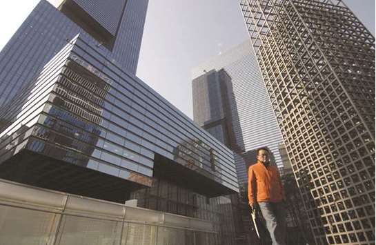 A pedestrian walks in front of the Samsung Electronics Co headquarters in Seoul. The conviction and jailing of South Koreau2019s top business tycoon heralds a drive to reform the countryu2019s giant conglomerates and loosen their grip on the economy.