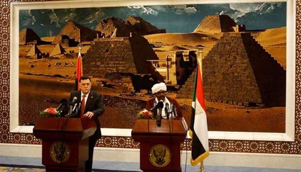 Sudanese President Omar al-Bashir and Libya's unity government chief Fayez al-Sarraj hold a press conference in Khartoum on Sunday.