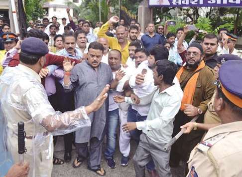 Police stop Mumbai Congress president Sanjay Nirupam from taking a delegation of striking cine workers to meet actor Bachchan in Mumbai yesterday.