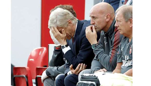 Arsenal manager Arsene Wenger looks dejected during his teamu2019s defeat against Liverpool at Anfield yesterday. (Reuters)
