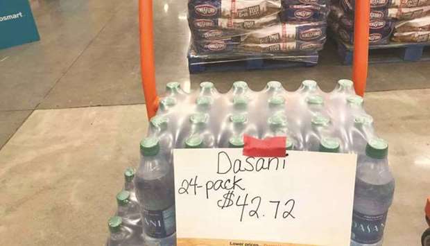 A pack of bottled water which normally costs $12 was sold for $42 with store shelves almost empty as people stocked up food and other essential items in preparation for the arrival of Hurricane Harvey in Houston.