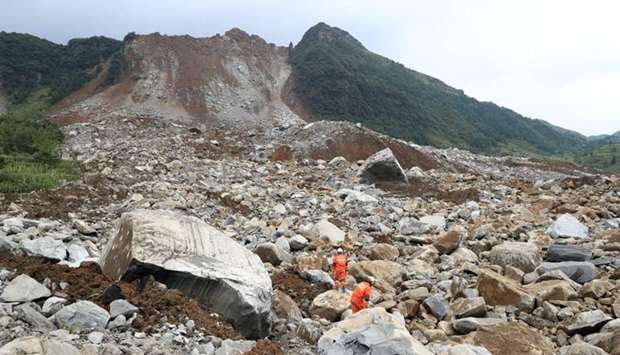 Rescue workers search for survivors at the site of a landslide that occurred in Nayong county, Guizhou province.  Reuters