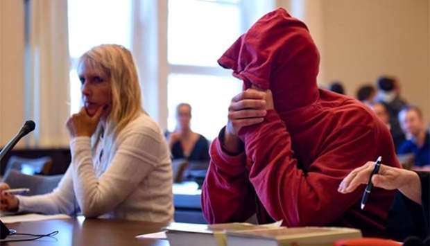 A 21-year-old Dutchman waits for his trial in a courtroom in Hamburg on Monday.
