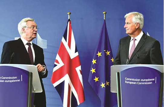 Davis and Barnier at the news conference at the European Union Commission Headquarters in Brussels yesterday.