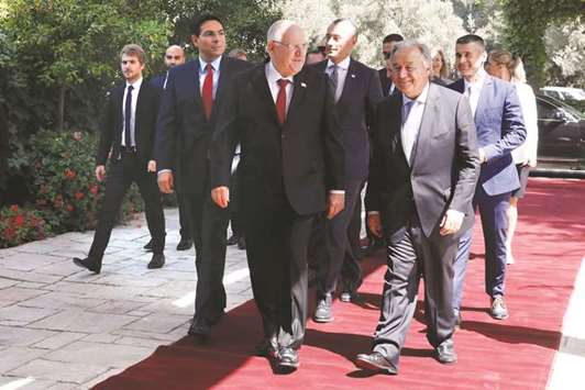 Israeli President Reuven Rivlin welcomes UN Secretary-General Antonio Guterres upon his arrival at the presidential compound in Jerusalem yesterday.