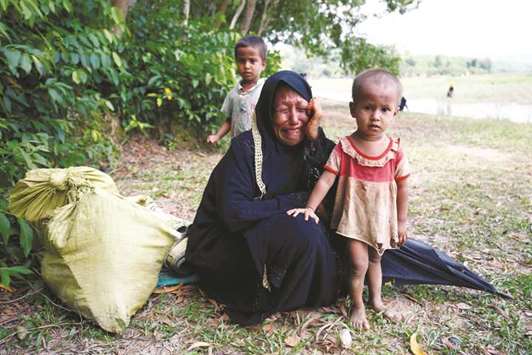 A Rohingya woman cries with her child, after being restricted by the members of Border Guards Bangladesh (BGB) to further enter the Bangladesh side, in Coxu2019s Bazar, yesterday.