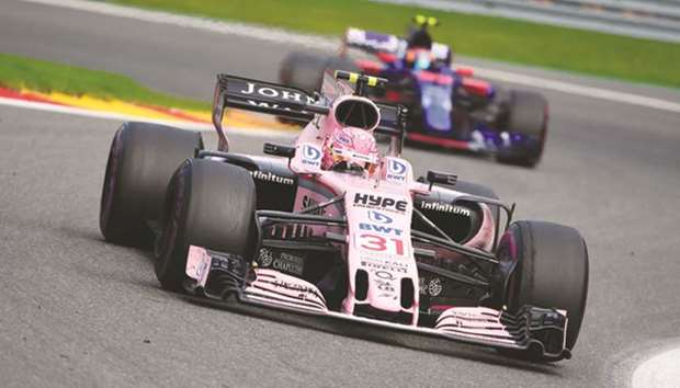 Force Indiau2019s French driver Esteban Ocon drives ahead of Toro Rossou2019s Spanish driver Carlos Sainz Jr during the Belgian Formula One Grand Prix at the Spa-Francorchamps circuit in Spa on August 27.