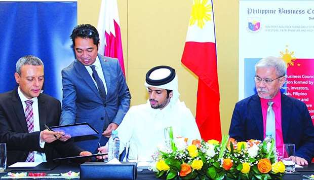 Al Sawari Holding chairman Sheikh Turki bin Faisal al-Thani exchange documents with Al Sawari Holding managing director Mohamed Shafiek during the MoU signing ceremony while MMG Hospital group CEO Dr Jose Tiongco and PBC-Q chairman Greg Loayon look on. PICTURE: Ram Chand