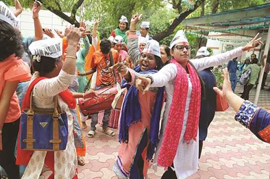 AAP supporters celebrate after the party won the Bawana assembly seat, in New Delhi yesterday.