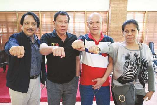 Founding Chairman of Volunteers Against Crime and Corruption, Dante Jimenez, President Rodrigo Duterte and Saldy and Lorenza de los Santos at Malacanang presidential complex in metro Manila.