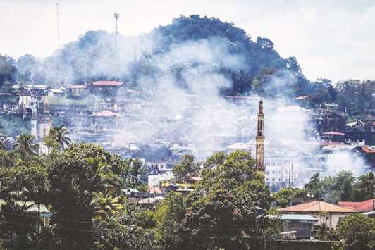 Smoke rises from houses as battles continue in Marawi on the southern island of Mindanao.