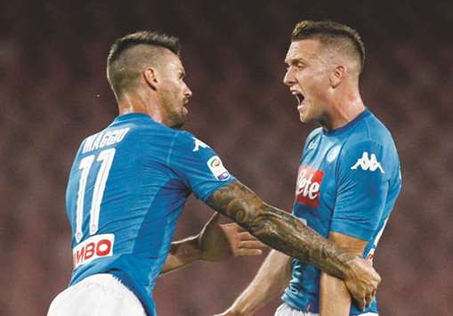 Napoliu2019s Piotr Zielinski (right) celebrates after scoring against Atalanta. (AFP)
