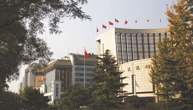 The Peopleu2019s Bank of China headquarters (right) in Beijing. The capacity of Chinau2019s central bank to surprise markets is so great that, last week, it left investors chewing over whether a data error was a policy signal.