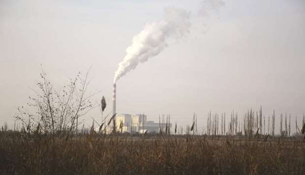 White smoke bellows from Shenhua Groupu2019s power plant in Xinjiang province. The Shenhua-Guodian tie-up may be the first of a handful of mergers in Chinau2019s power industry as top policymakers try to cut industrial overcapacity and the number of state-owned enterprises.