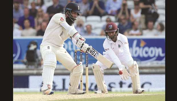 Englandu2019s Moeen Ali (left) bats on the fourth day of the second Test against the West Indies at Headingley cricket ground in Leeds, England, yesterday. (AFP)