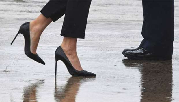 First Lady Melania Trump walks on high heels to board Air Force One at Andrews Air Force Base, Maryland, on Tuesday en route to Texas to view the damage caused by Hurricane Harvey.