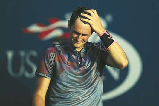 Bernard Tomic of Australia reacts during his first round match against Gilles Muller of Luxembourg on Monday.