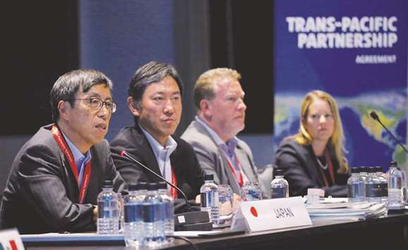 Japanu2019s chief trade negotiator Kazuyoshi Umemoto (left) speaks at the Trans Pacific Partnership meeting in Sydney yesterday. Among the areas being discussed, Vietnam has raised the prospect of changes to labour rights and intellectual property provisions in the original pact, one source familiar with the talks told Reuters.