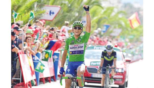 Quick-Step Floorsu2019 rider Matteo Trentin celebrates as he crosses the finish line to win the 10th stage of the Vuelta a Espana in Alhama de Murcia, Spain, yesterday. (AFP)
