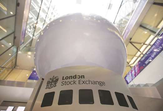 A logo is displayed on an interactive sculpture in the main atrium of the London Stock Exchange. The FTSE 100 closed down 0.9% to 7,337.43 points yesterday.