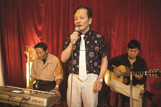 Nguyen Van Loc, singer and former political prisoner, sings at his small Hanoi cafe to a crowd of mostly elderly Vietnamese.