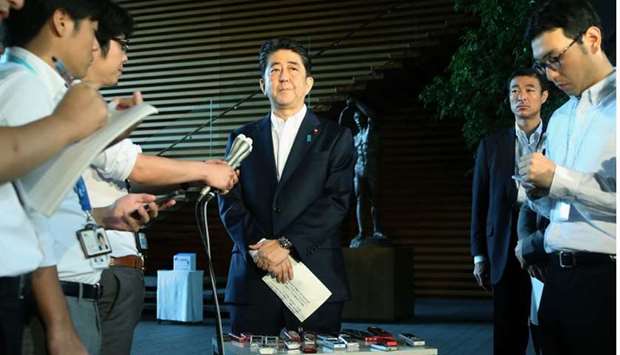 Japan's Prime Minister Shinzo Abe speaks to the media at his official residence in Tokyo on August 29, 2017, after a ballistic missile was launched by North Korea.