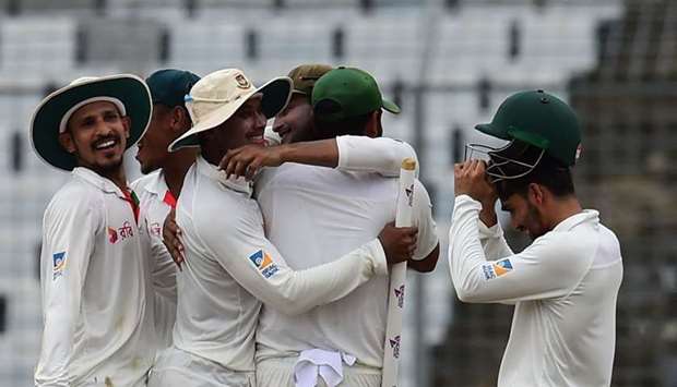 Bangladeshi cricketers celebrate after winning the first Test cricket match between Bangladesh and Australia at the Sher-e-Bangla National Cricket Stadium in Dhaka