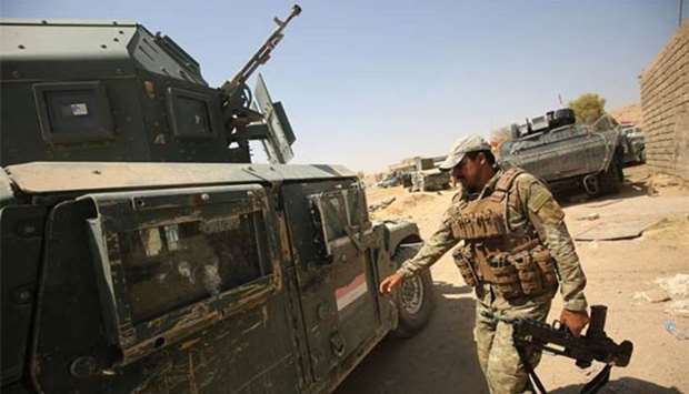 Iraqi forces advance towards the al-Ayadieh area, north of Tal Afar, on Wednesday.