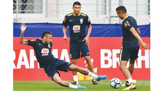 Brazilu2019s Neymar (left), Thiago Silva (centre) and Marquinhos take part in a training session at the Gremio team training centre in Porto Alegre, Brazil on Tuesday.  (AFP)