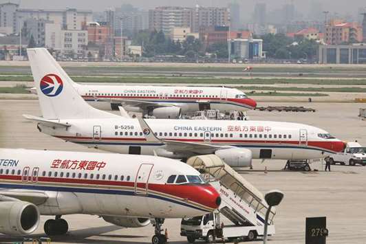 China Eastern Airlines planes are seen on the tarmac at Hongqiao International Airport in Shanghai. Chinau2019s state-owned airlines serve the worldu2019s fastest growing air travel market but their margins are being dampened by their aggressive expansion of plane fleets and unhedged positions on fuel which has made them vulnerable to a 28% rise in price over the period.