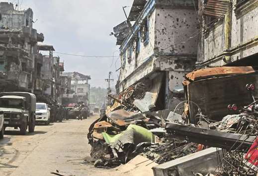 Damaged buildings and houses after days of intense fighting between soldiers and insurgents from the Maute group, who have taken over parts of Marawi city.