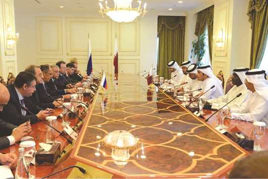 The Qatari and Russian delegations at their meeting in Doha yesterday.