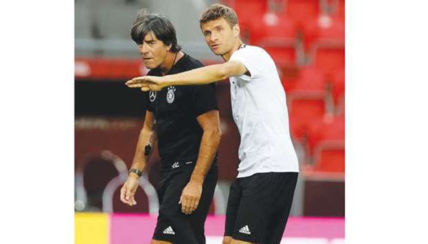 Germany coach Joachim Loew (left) and striker Thomas Muller during a training  in Prague, Czech Republic, yesterday. (Reuters)