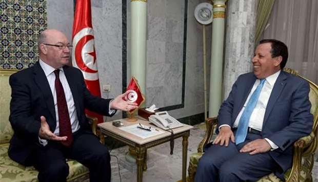 Alistair Burt (left), British minister of state for the Middle East and North Africa, speaks with Tunisian Foreign Minister Khamaies Jhinaoui during a meeting in Tunis on Thursday.