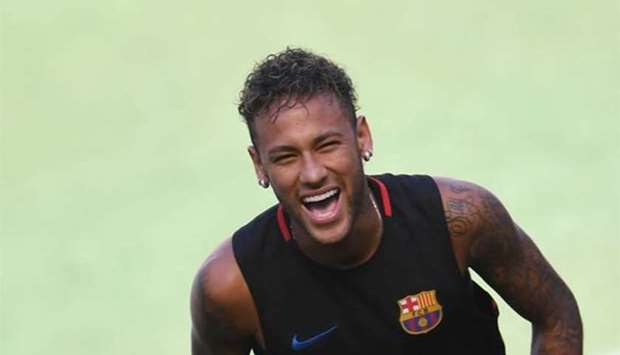 Barcelona's Brazilian forward Neymar smiling during a training session.