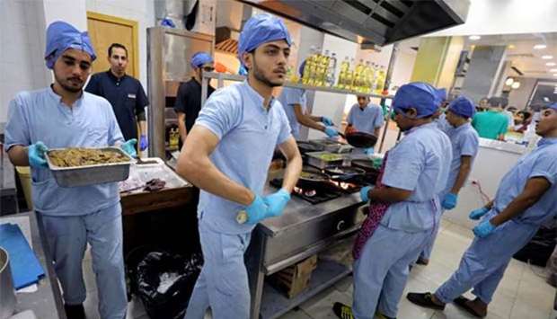Employees dressed as doctors work in the operating room-themed fast food restaurant in Damanhour, Egypt.