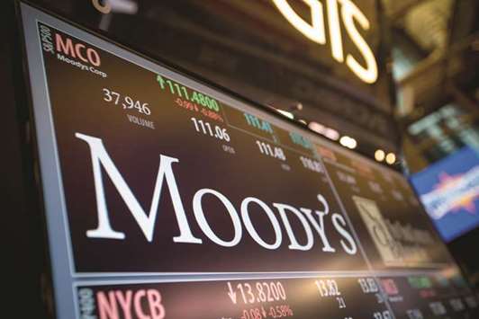 A monitor displays Moodyu2019s Corporation signage on the floor of the New York Stock Exchange. A court ruling last week to pursue bans on diesel cars in the city of Stuttgart could trigger a fall in the second-hand vehicle market used to underpin a system of cheap credit finance, says Moodyu2019s.