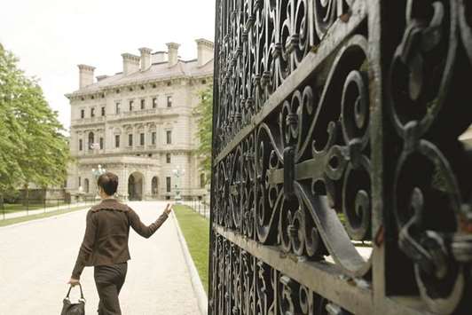 A visitor enters the gates of the Breakers, the largest and most imposing of the Newport, R.I., mansions. The 70 room u201ccottageu201d was built by industrialist Cornelius Vanderbilt II in 1893